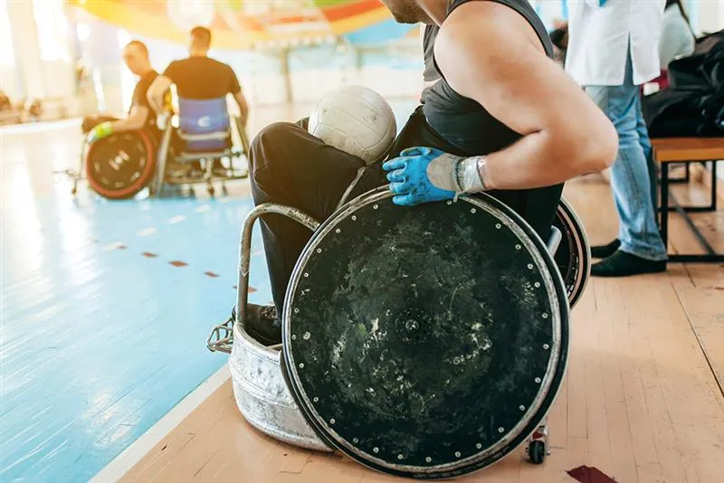 athlete in a wheelchair playing wheelchair rugby