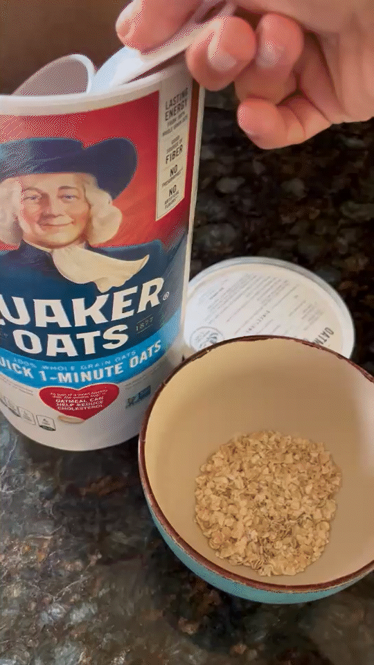 Pouring dried oatmeal in a bowl.