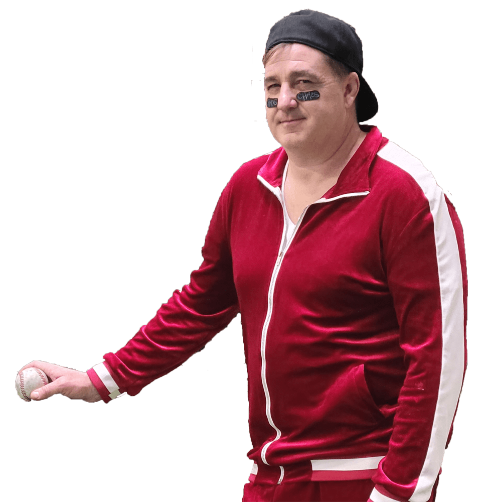 Chaos with a baseball hat on backwards, holding a baseball, with black under his eyes.