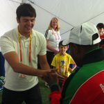 USADA athlete shaking hands with a Kenyan coach.