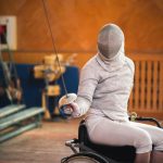 Athlete in wheelchair fencing