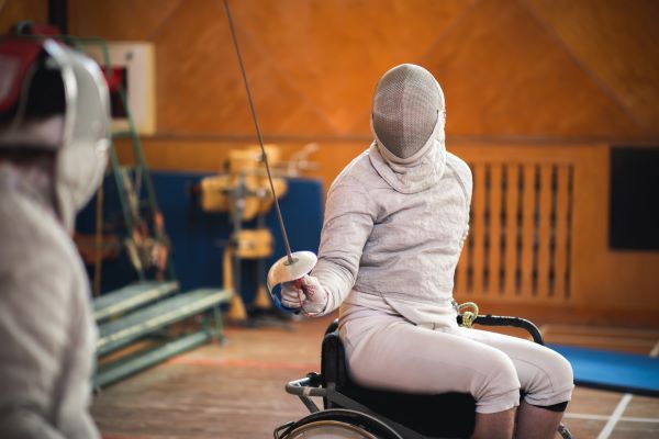 Athlete in wheelchair fencing