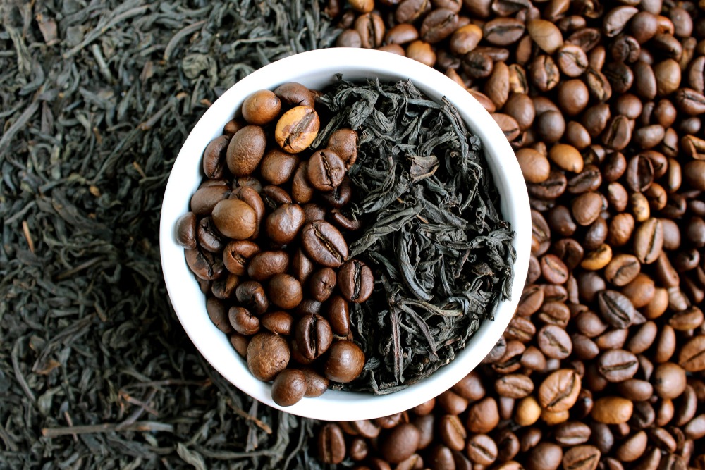 Bowl of coffee beans and tea leaves.