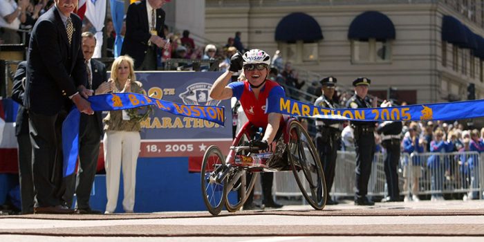 cheri blauwet crossing finsih line at boston marathon