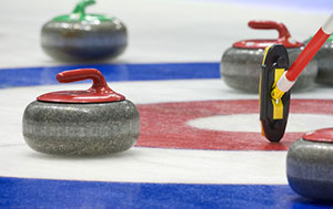 Curling stones on the ice.