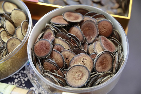 Slices of deer antler velvet in a plastic bowl.