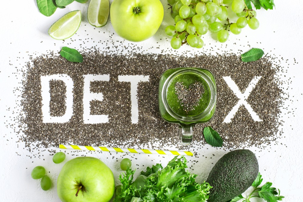 The word DETOX made out of chia seeds and a smoothie.