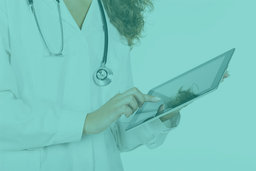 Close up of a female doctor touching an tablet.