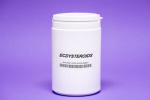 Supplement container labeled ecdysteroids against a purple background.