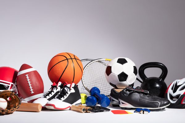 A variety of sports equipment against a white background.