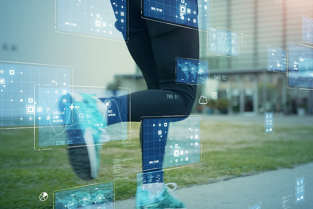 Closeup of runners legs with overlay of technical screens.