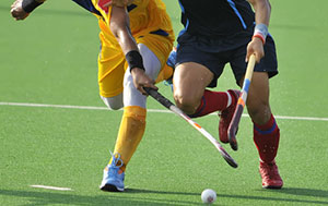 two field hockey athletes on the field