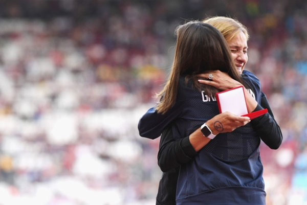 Kara Goucher receiving a medal