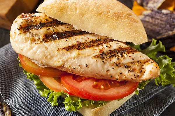 Grilled chicken sandwich with lettuce and tomato