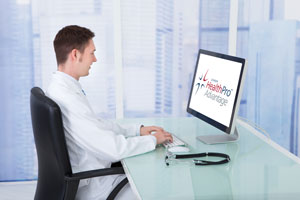 A doctor sitting in front of a laptop with the HealthPro Advantage logo on the screen.
