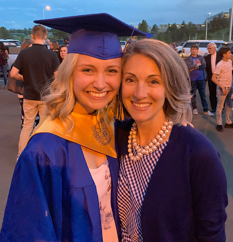 Jen Royer next to her high school graduate mentee