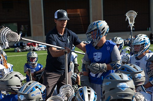 lacrosse coach with athlete