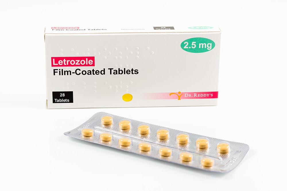 Box of Letrozole medication with yellow tablets.