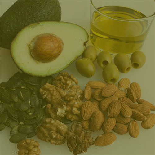 avocado, nuts, olives with green overlay