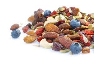 pile of trail mix made of nuts and berries