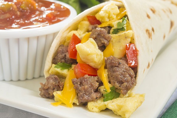 breakfast burrito with eggs, sausage, cheese, and vegetables