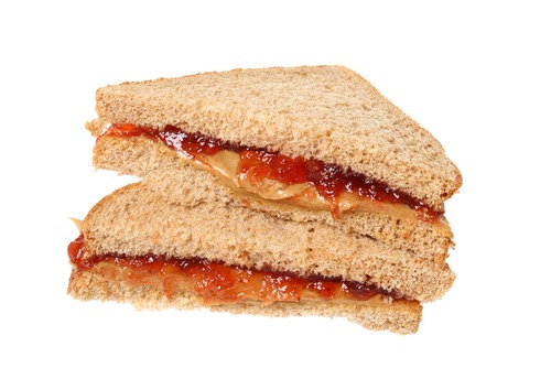 Sliced peanut butter and jelly sandwich.