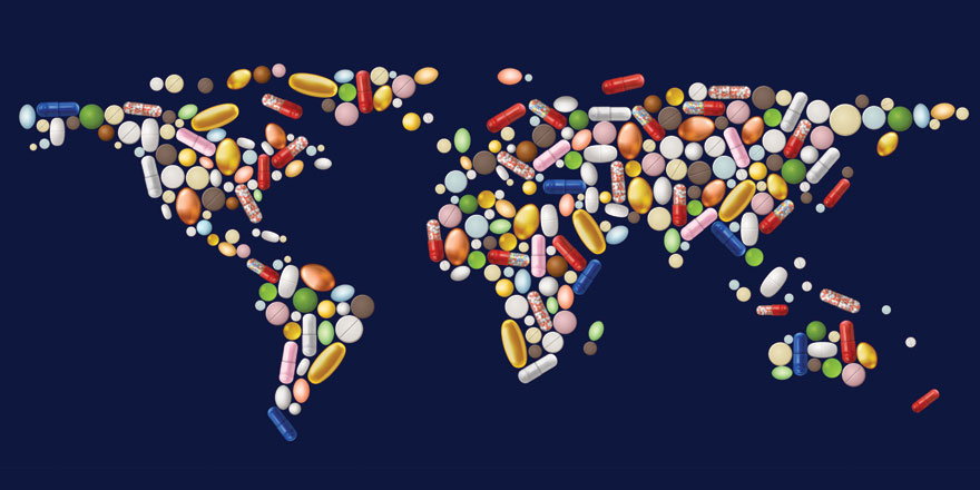 multi-colored pills in shape of world map on blue background