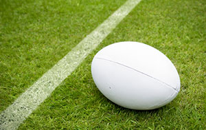 A rugby ball on a field.