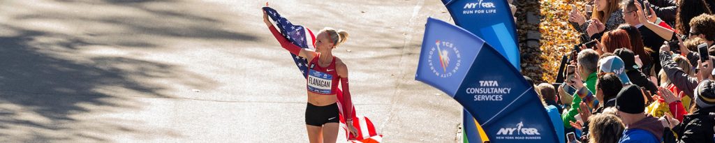 Shalane Flanagan holding USA flag