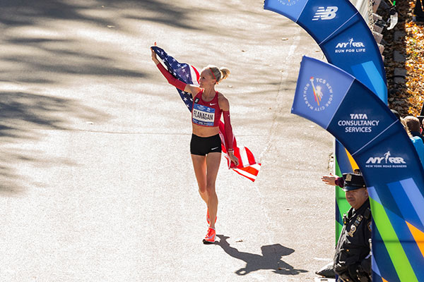 Shalane Flanagan holding USA flag