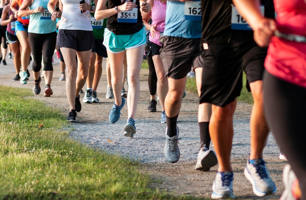Men and women running in a recreational race.