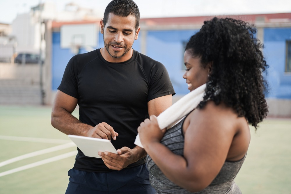 Athlete and coach talking.