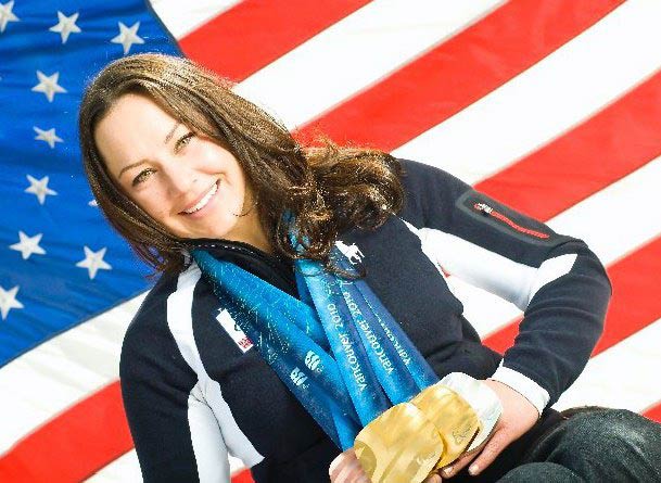 Alana Nichols holding her paralympic medals.