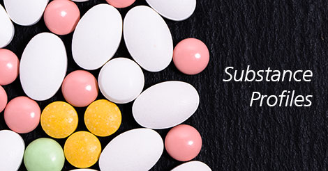 Substance profiles wit multi colored pills on black background