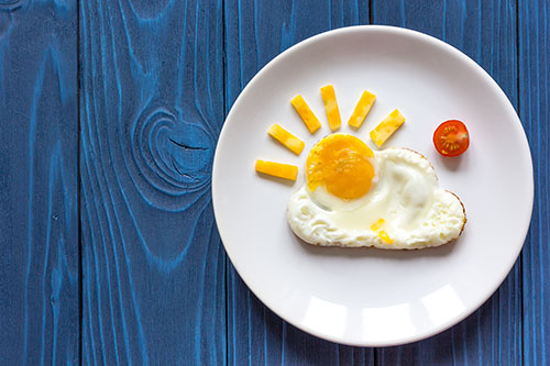 sunshine egg on blue background