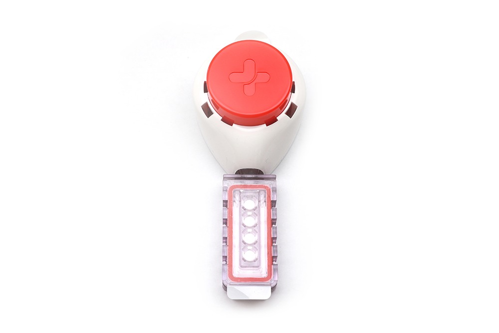 TASSO blood collection device for dried blood spot testing on white background.