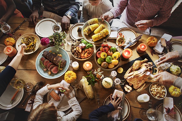 Thanksgiving dinner spread over a table.