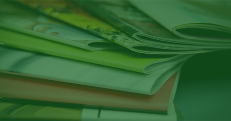 pile of publications with green overlay