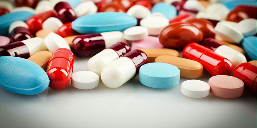 multi-colored pills on table